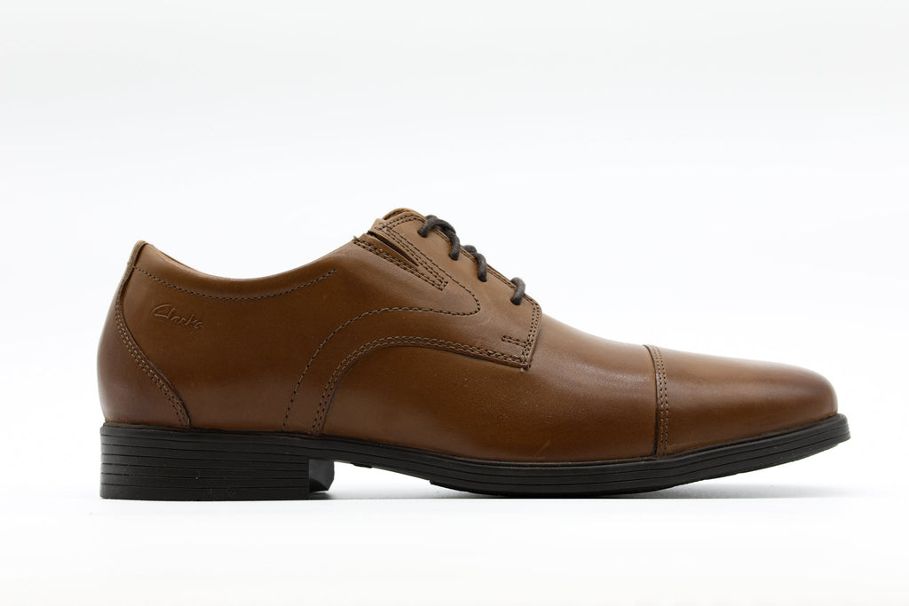 Clarks men's leather cap-toe Oxford dress shoe with black lace-up closure and block heel