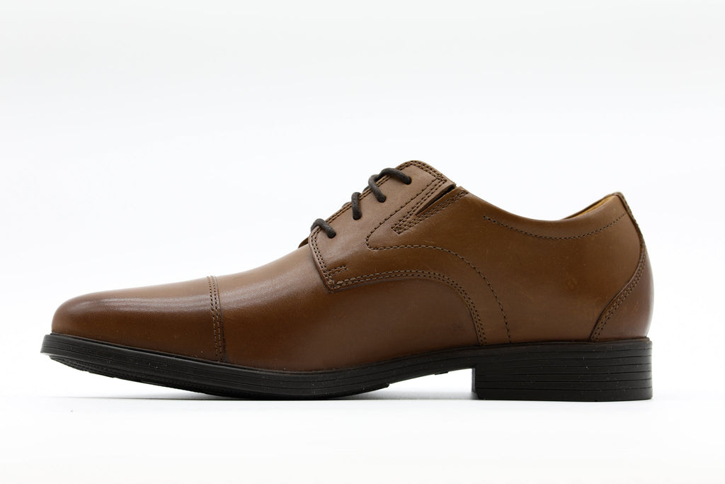 Men's brown leather cap-toe Oxford dress shoe with lace-up closure and stacked heel