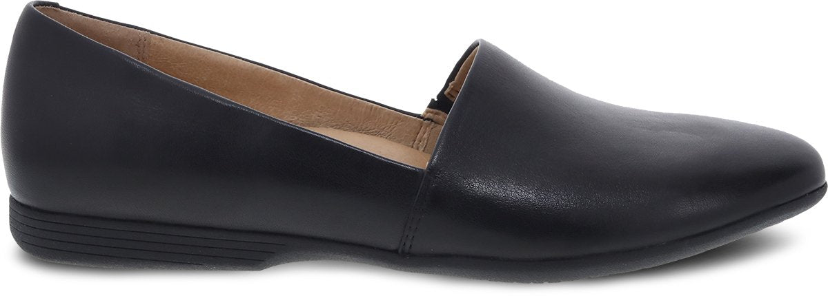 Dansko women's leather slip-on loafer flat with almond toe and low heel, side view