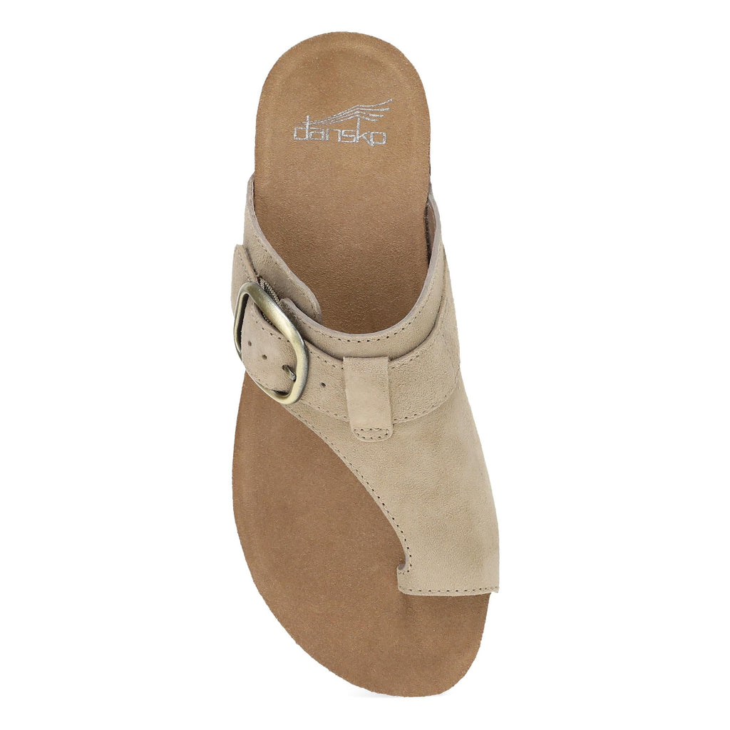 Dansko thong sandal with adjustable buckle strap viewed from above on white background