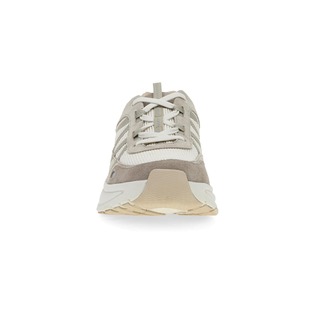 Front toe view of a lace-up sneaker with suede overlays and chunky cream sole