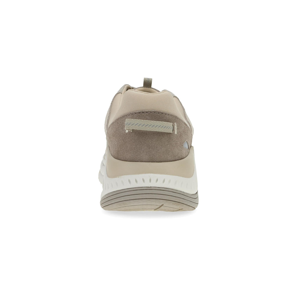 Rear view of a women's sneaker with suede heel panel and chunky white sole