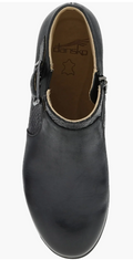 Top-down view of a black leather Dansko clog with buckle strap detail