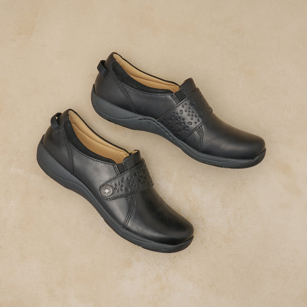 Dansko Sallie women's slip-on shoes with velcro strap and perforated detail, pair shown