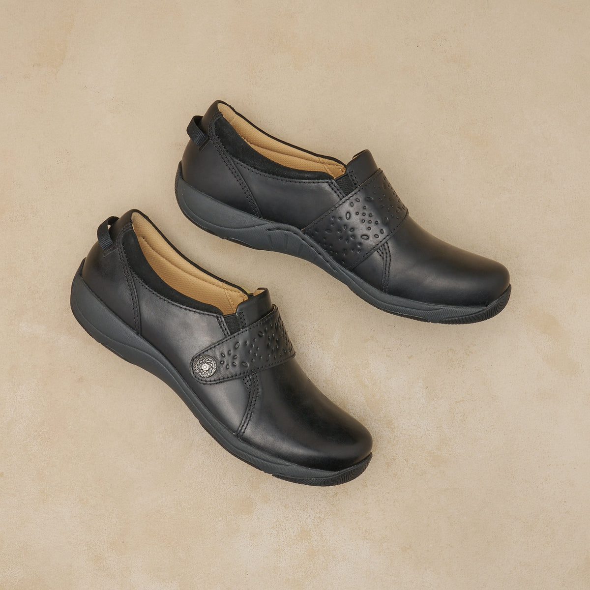 Dansko Sallie women's slip-on shoes with velcro strap and perforated detail, pair shown