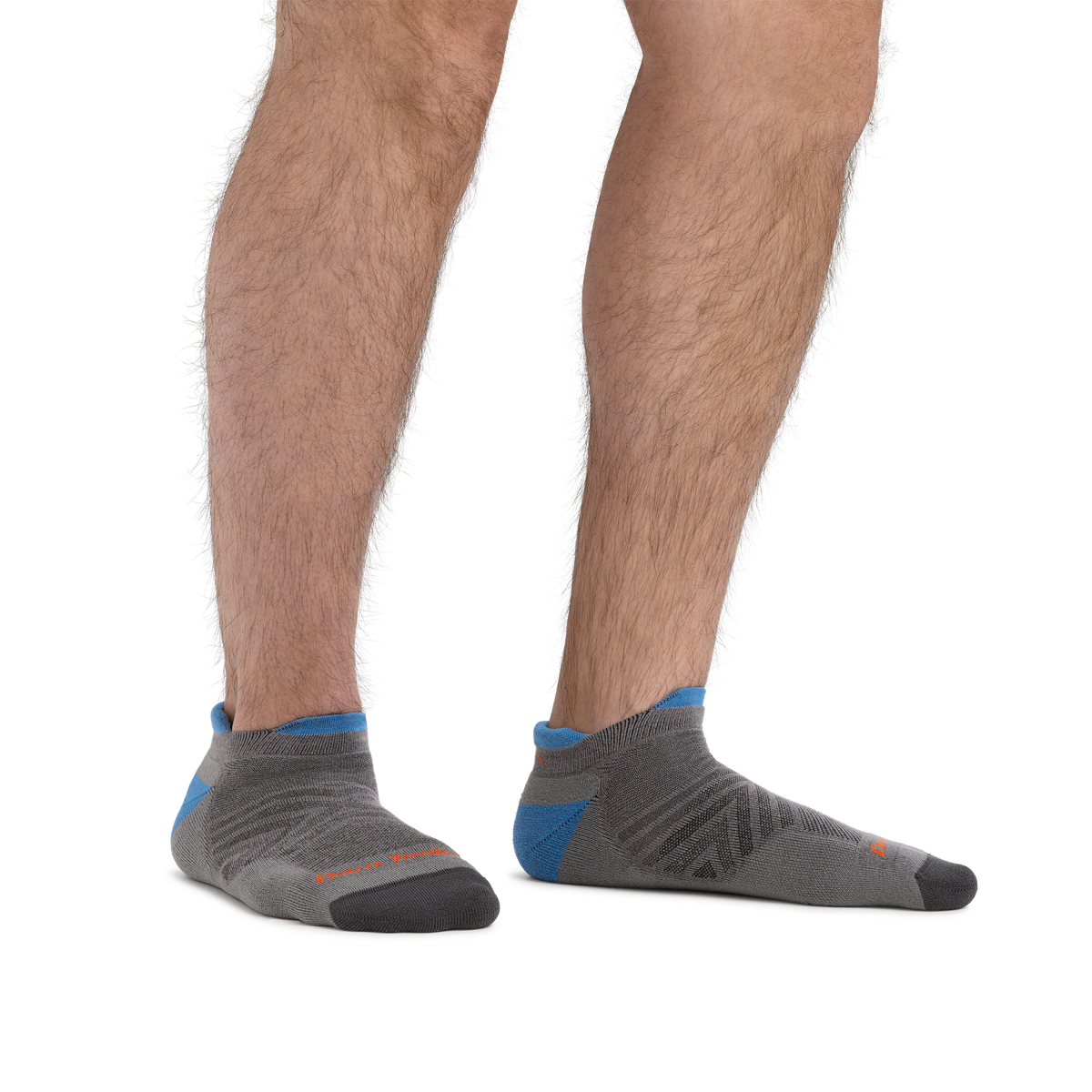 Man wearing gray no-show tab running socks with blue heel accent and dark toe cap