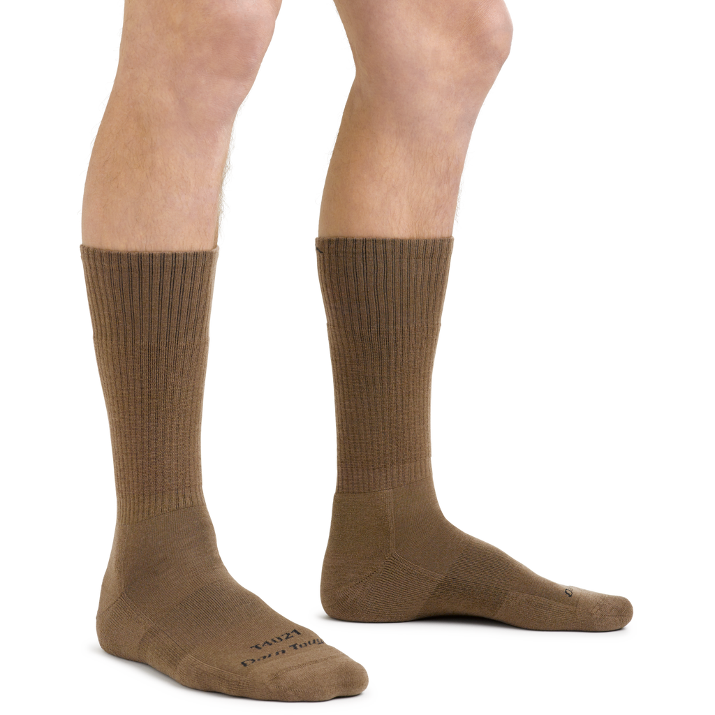 Man wearing Darn Tough midweight cushion tactical boot socks in tan, side view