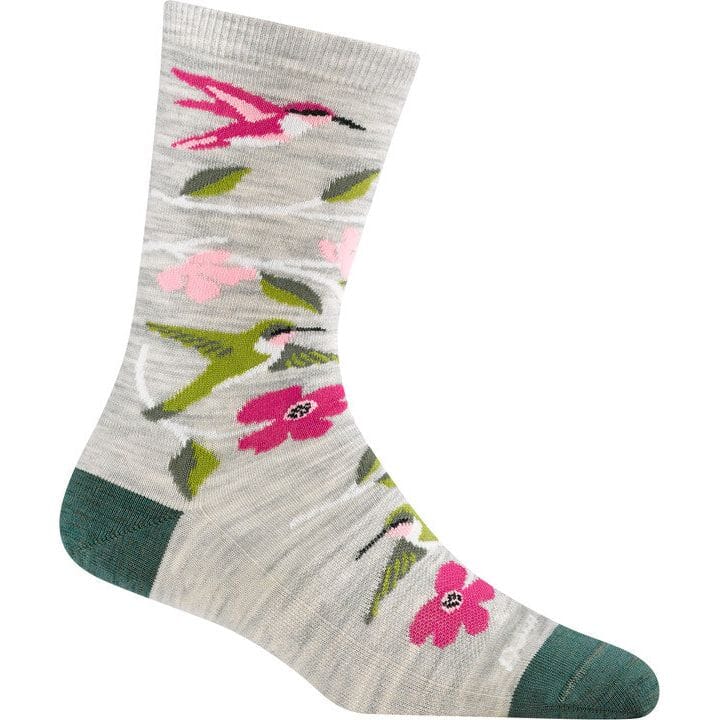 Darn Tough crew sock featuring hummingbirds and pink flowers on light heathered background