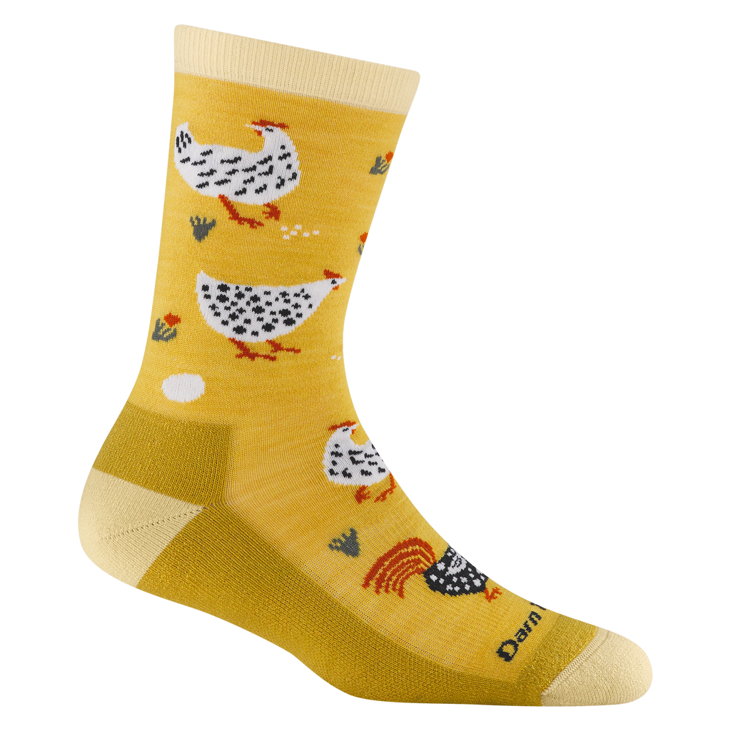 Darn Tough crew sock featuring illustrated hens, rooster, and egg pattern on golden yellow background