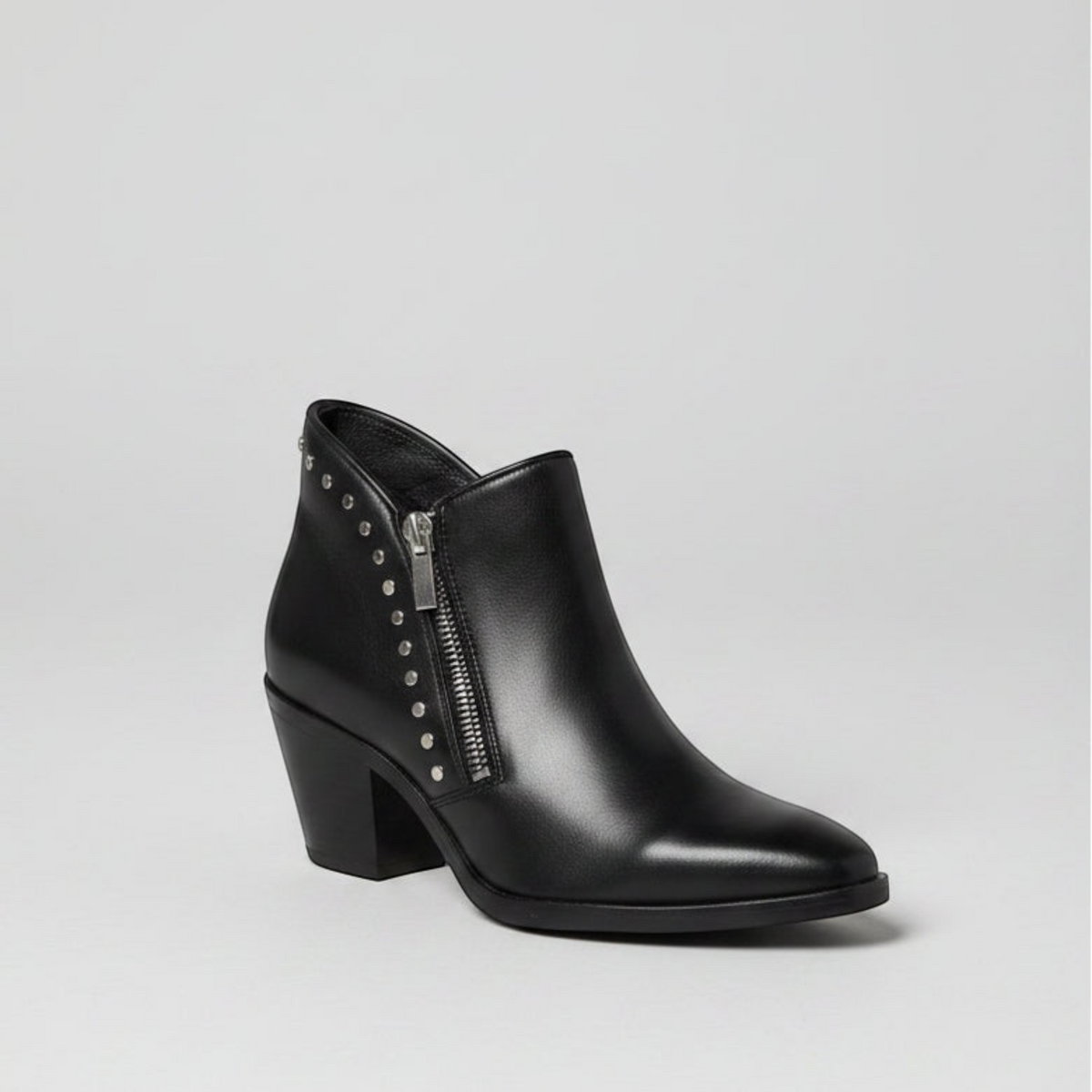 Women's ankle bootie with block heel, side zipper, and silver stud detailing along the edge