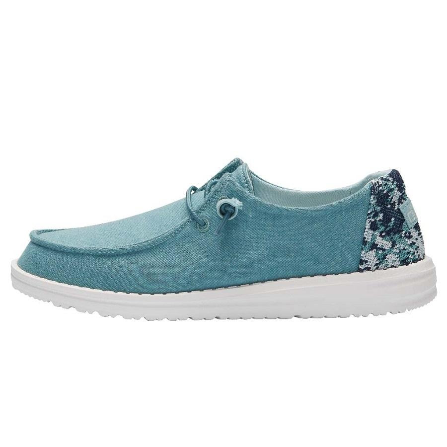 Hey Dude Wendy teal canvas slip-on shoe with floral sequin heel accent