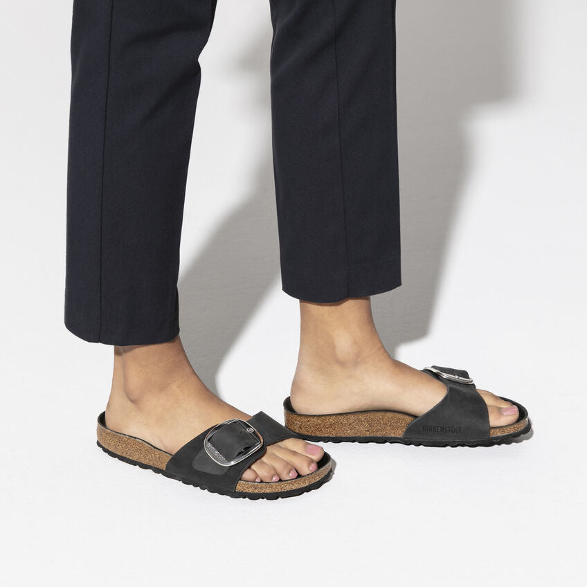 Birkenstock Madrid Big Buckle black oiled leather single-strap slide sandals on feet