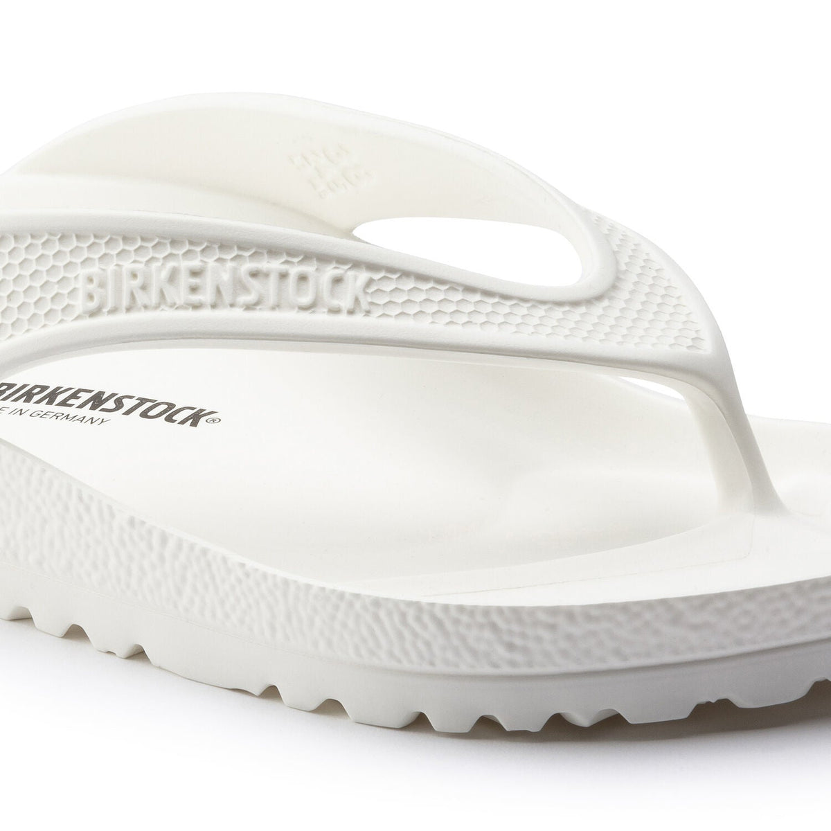 Birkenstock Honolulu EVA white flip flop sandal with textured sole and toe post