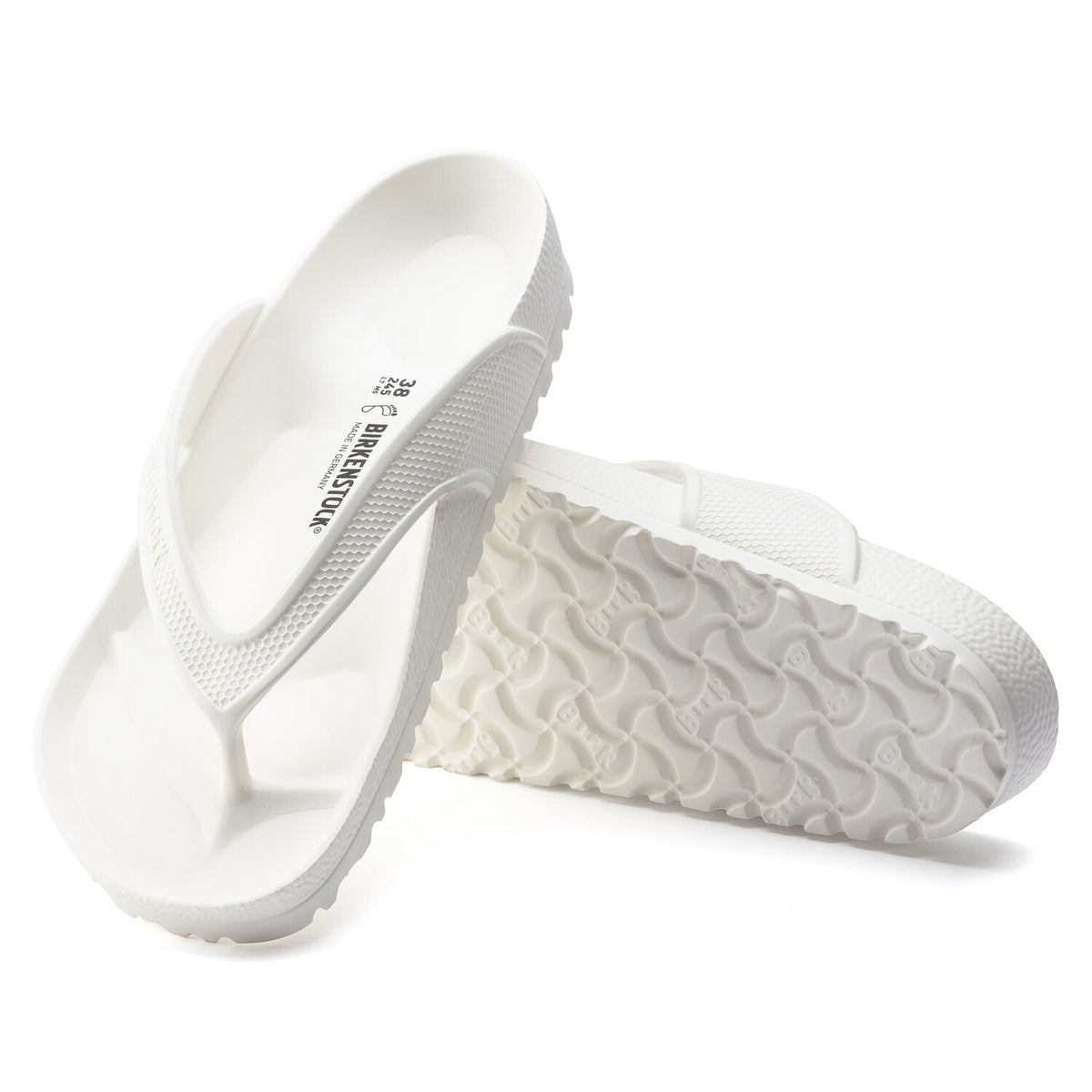 Birkenstock Honolulu white EVA flip flops showing footbed texture and outsole tread