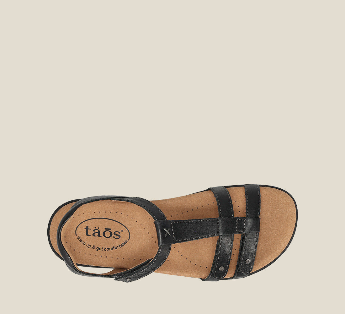 Taos Trophy 2 black leather women's sandal with T-strap and tan footbed, top view