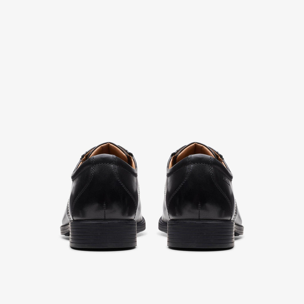 Clarks Whiddon Cap black leather dress shoes shown from rear angle as a pair