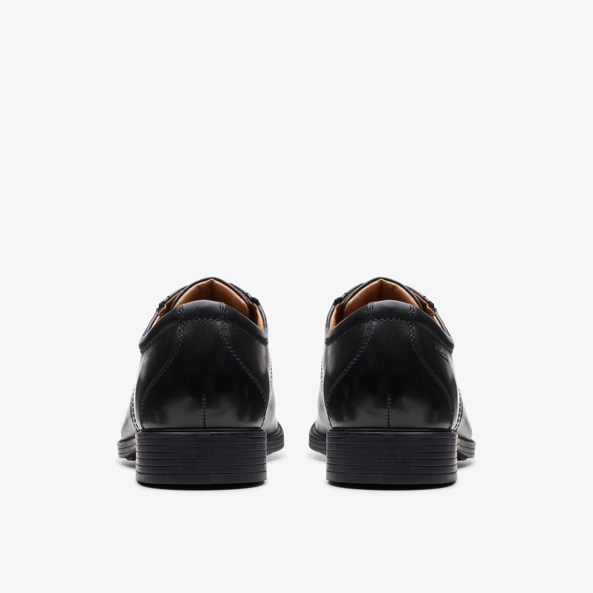 Clarks Whiddon Cap black leather dress shoes shown from rear angle as a pair