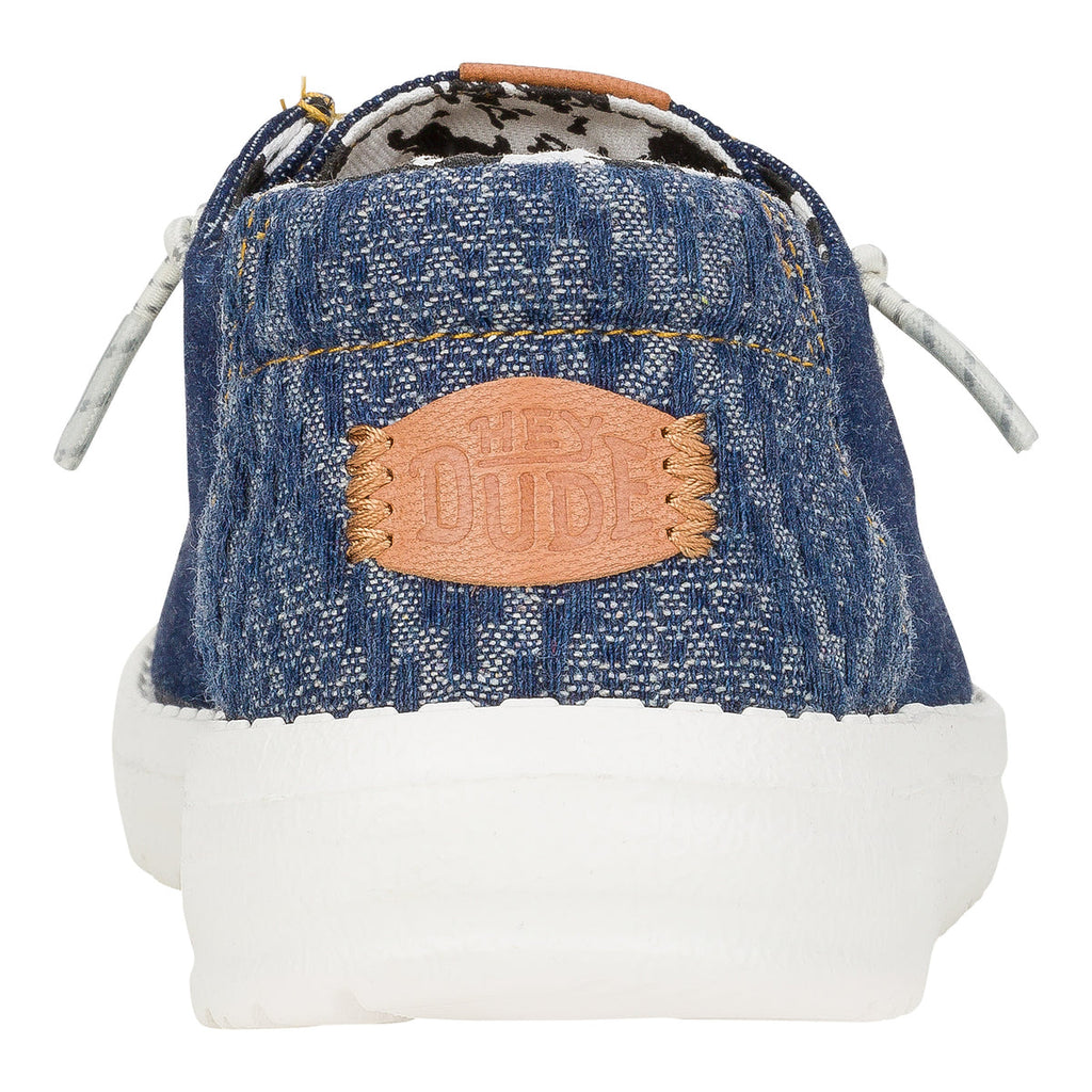 Hey Dude Wendy slip-on sneaker with denim upper, leather logo patch, and white sole