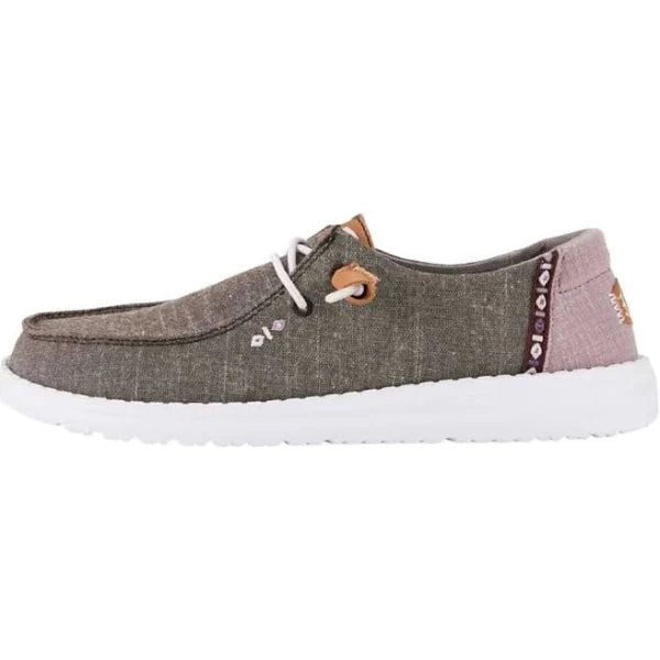 Hey Dude Wendy Chambray women's slip-on shoe in olive green with pink heel accent