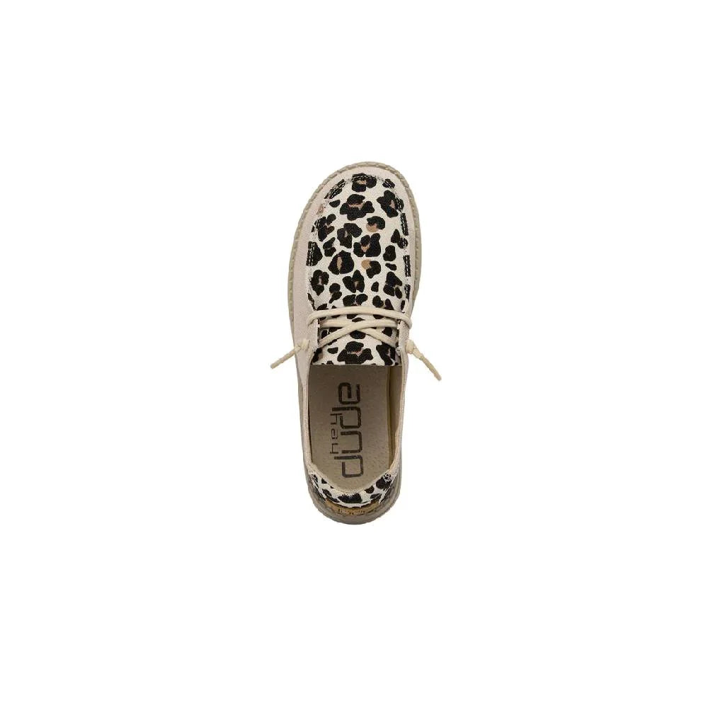 Top-down view of a leopard print lace-up casual shoe with Hey Dude insole branding