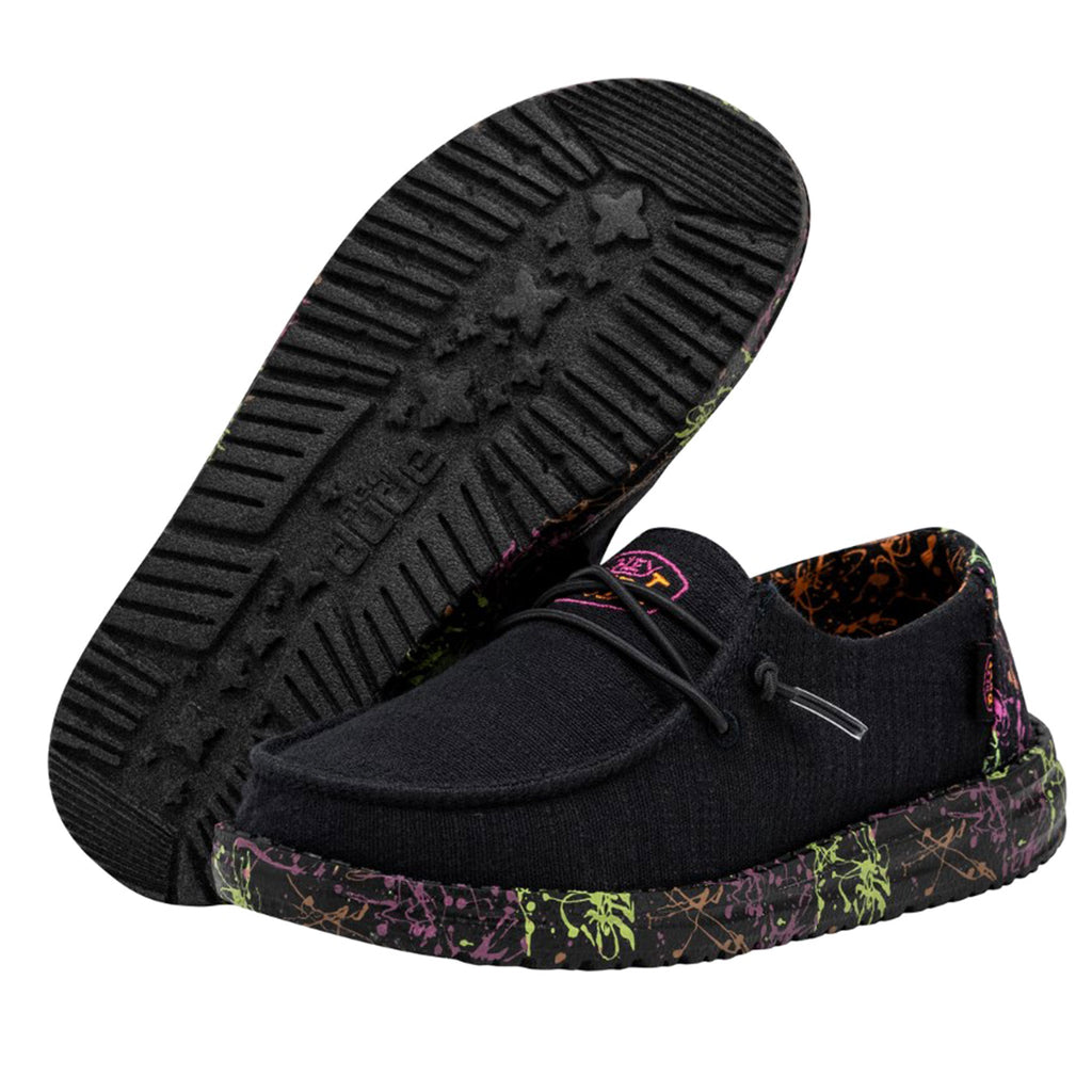 Hey Dude Girls Wendy slip-on shoe showing sole and upper with colorful splatter midsole