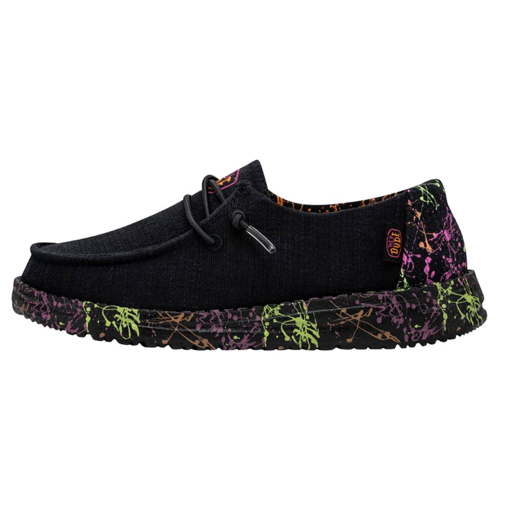 Hey Dude Girls Wendy slip-on shoe with neon paint splatter sole, side view