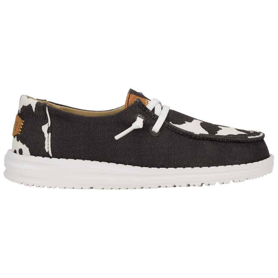 Hey Dude Girls Youth Wendy slip-on shoe with cow print accents and white sole