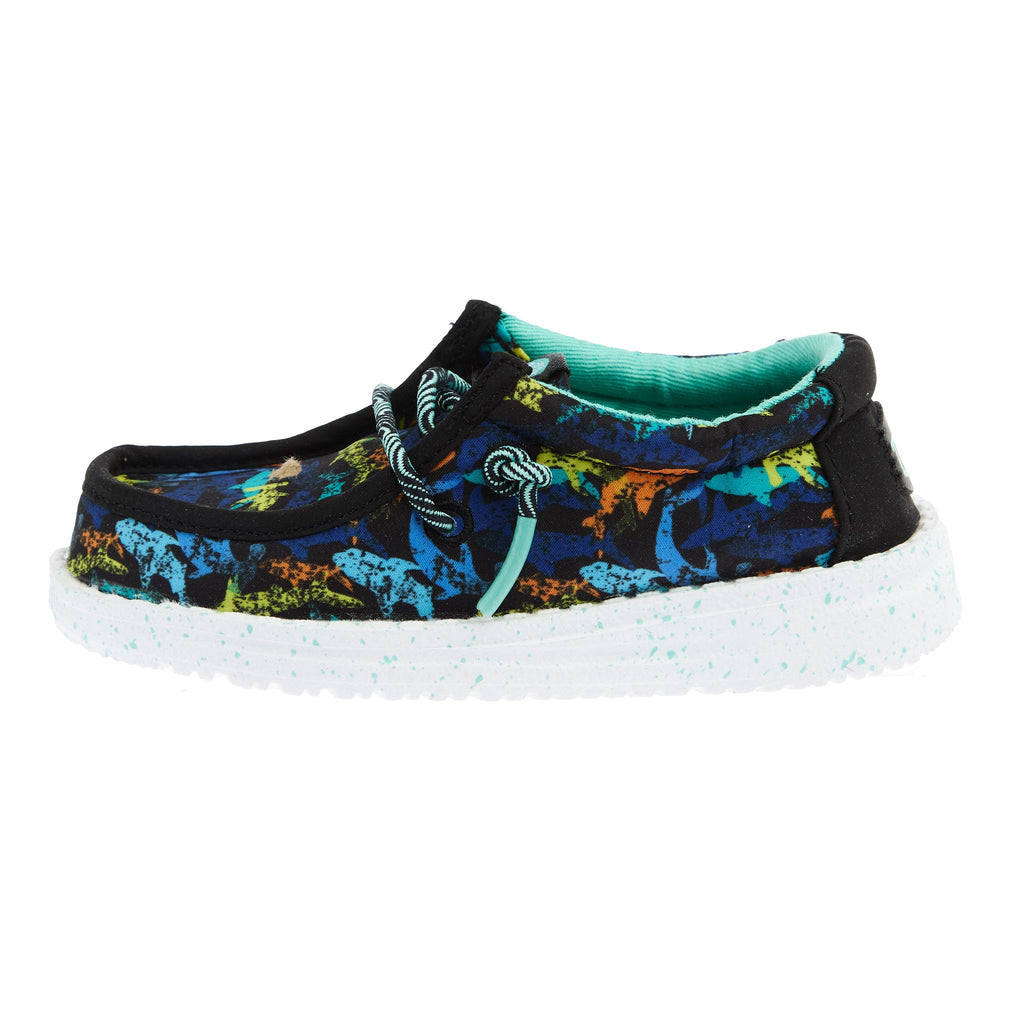 Hey Dude Boys Wally T slip-on shoe with colorful shark print and teal lining, side view