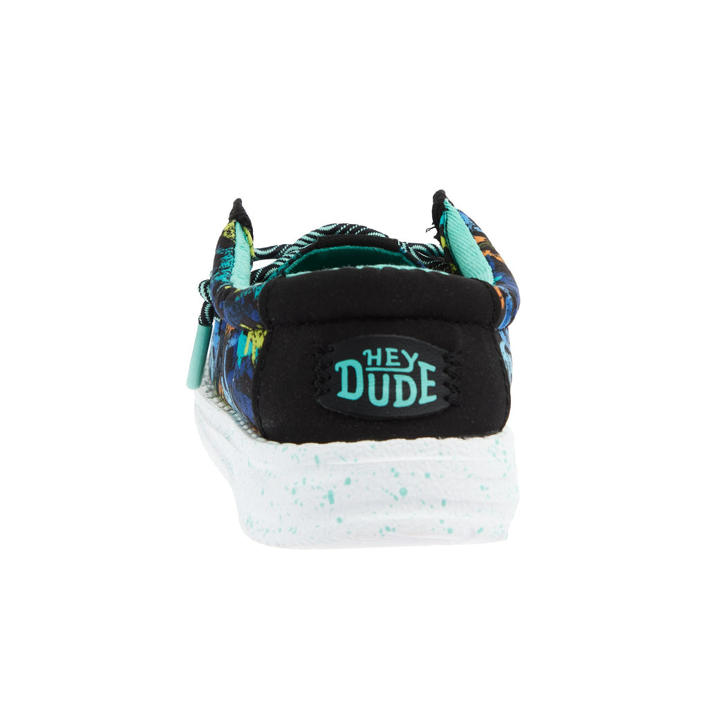 Hey Dude boys slip-on shoe rear view showing brand logo and speckled white sole