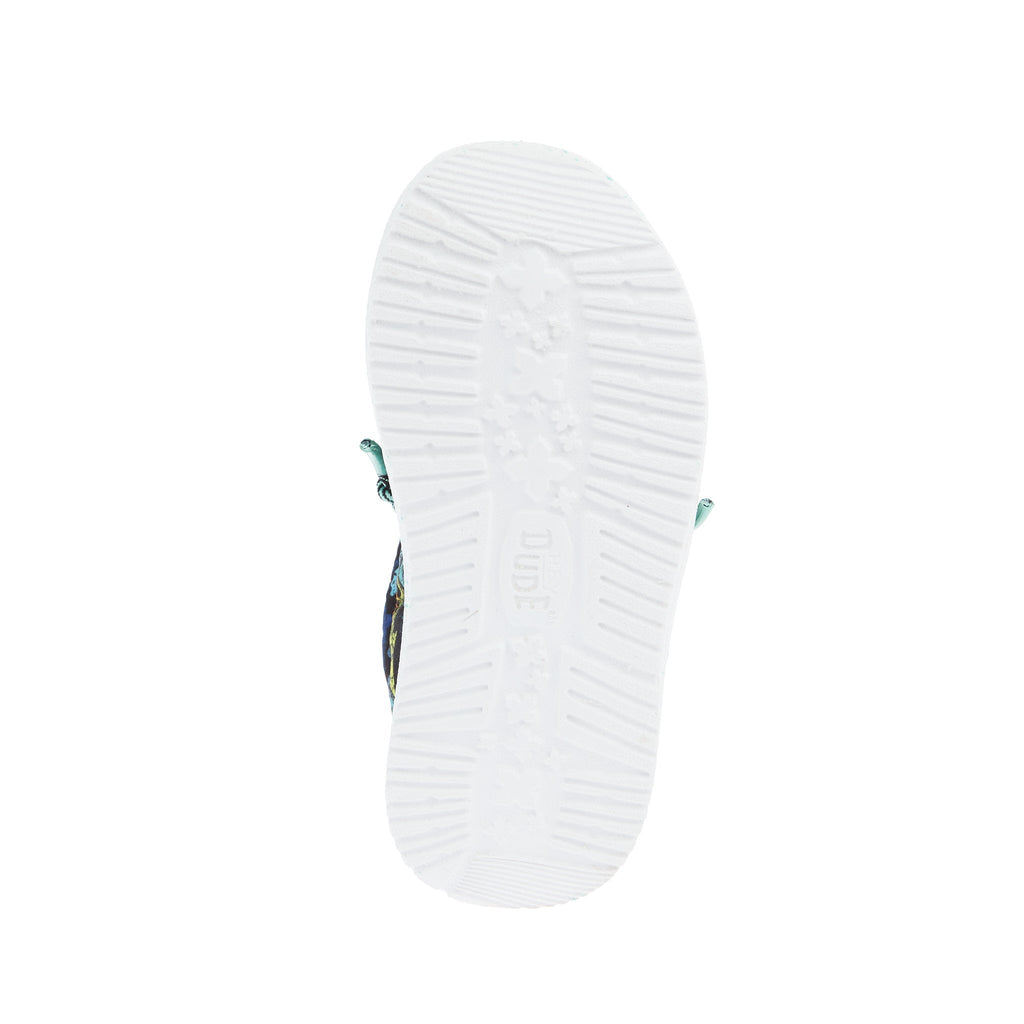 Bottom view of Hey Dude boys shoe showing white rubber outsole with tread pattern
