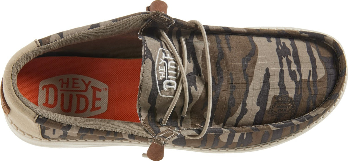 Top-down view of Hey Dude Wally slip-on shoe in camouflage pattern with laces