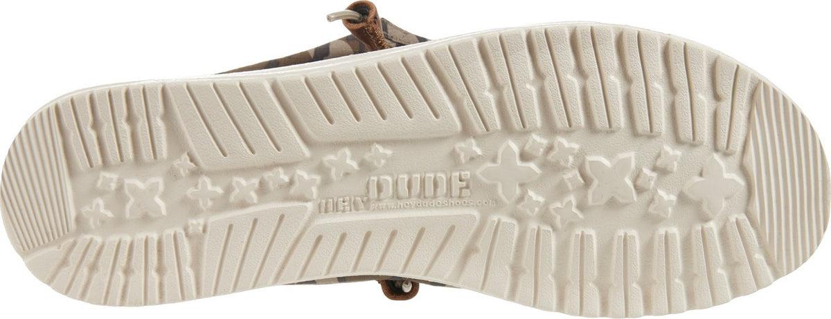 Bottom sole view of Hey Dude Wally shoe showing star-patterned outsole with brand logo