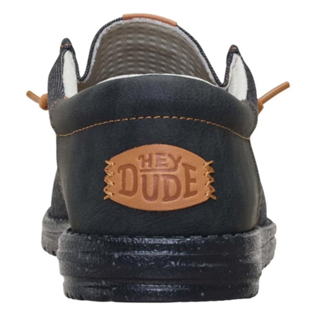 Hey Dude men's casual shoe rear view showing leather brand patch and laces