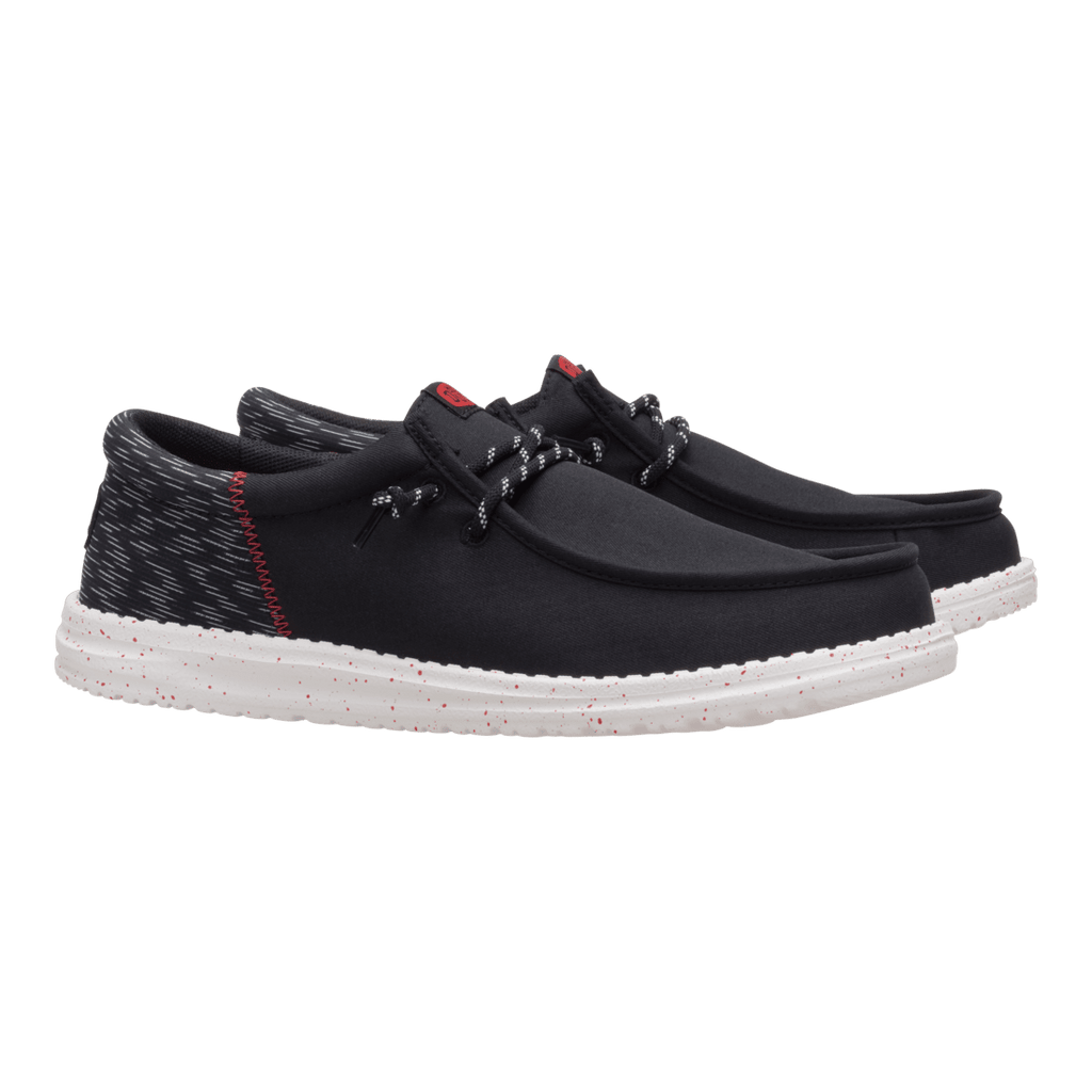 Hey Dude mens casual slip-on shoe with black upper, patterned heel, and speckled white sole