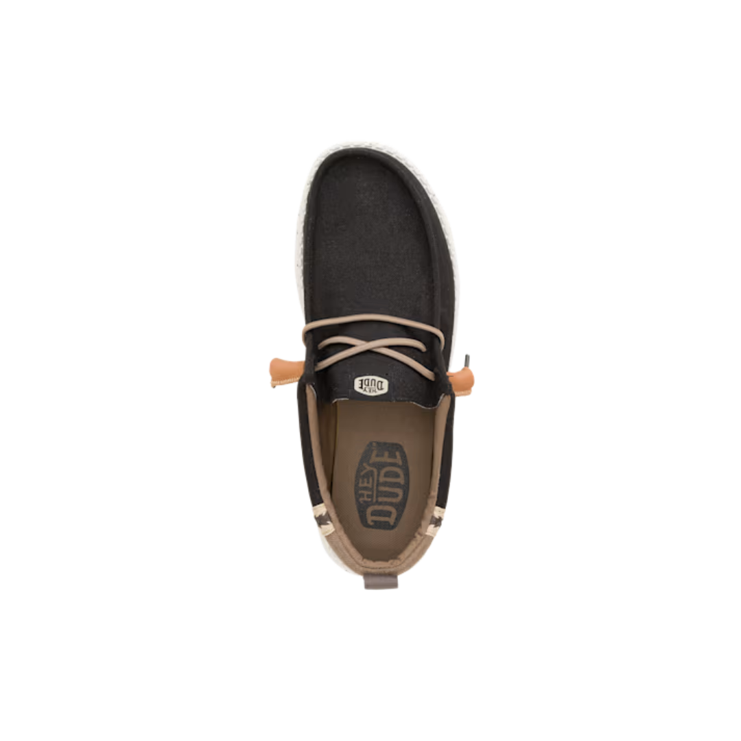 Top-down view of Hey Dude Wally slip-on shoe with lace detail and branded insole