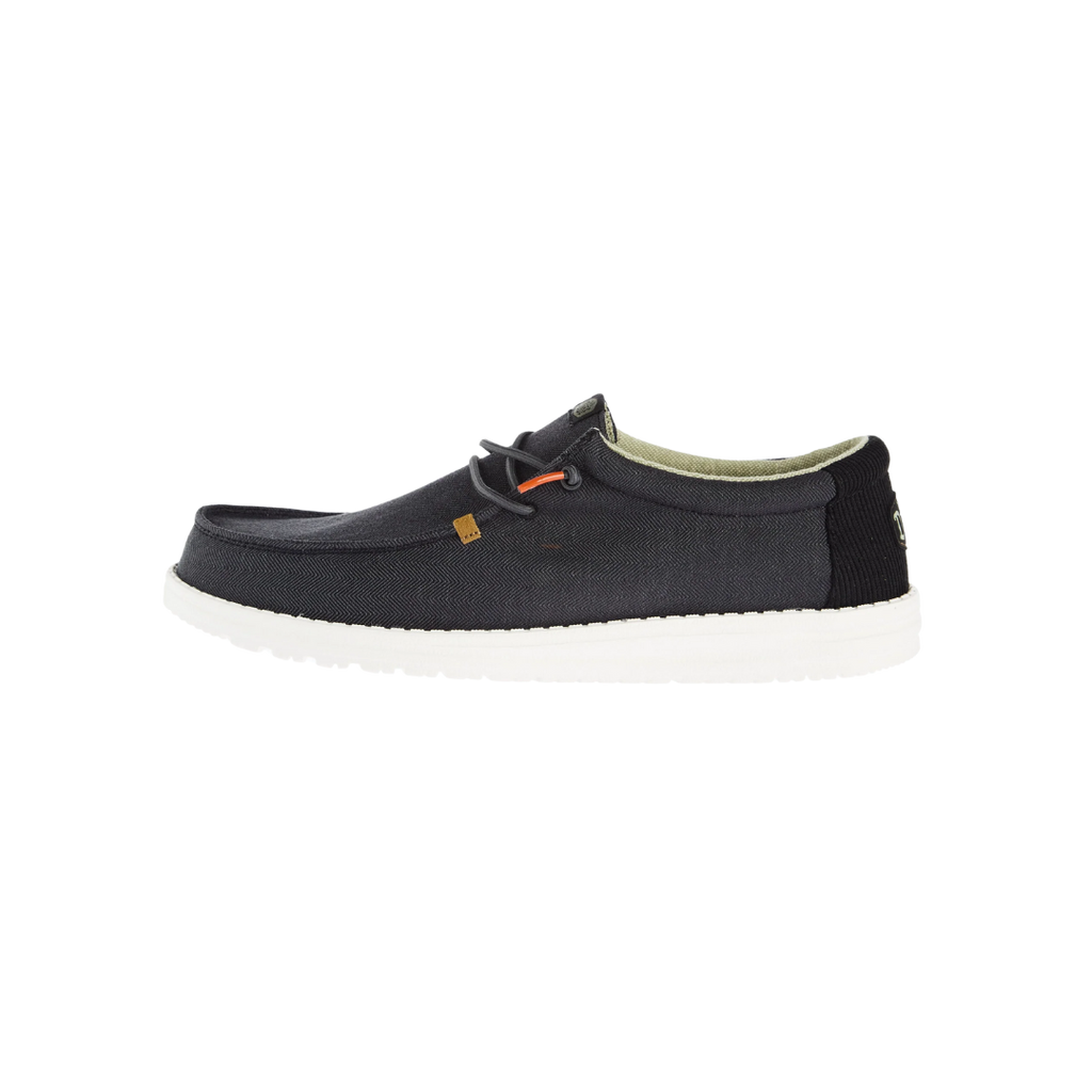 Hey Dude Wally Herringbone men's casual slip-on shoe with white sole, side view