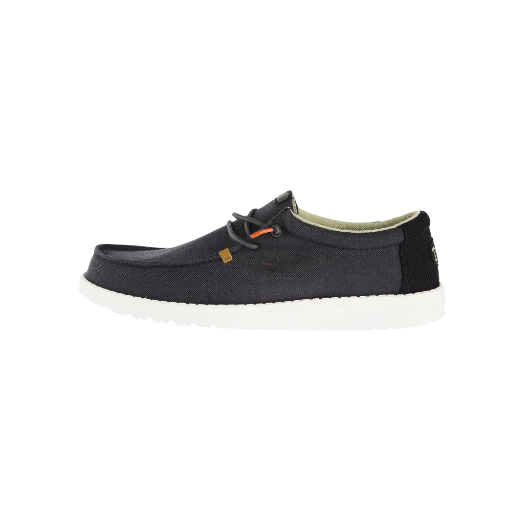 Hey Dude Wally Herringbone men's casual slip-on shoe with white sole, side view