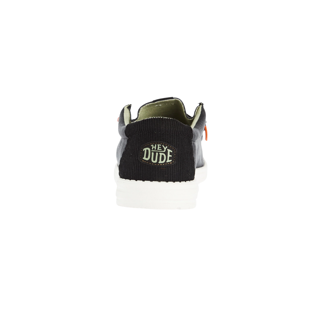 Hey Dude Wally shoe rear view showing black knit heel pull tab with logo