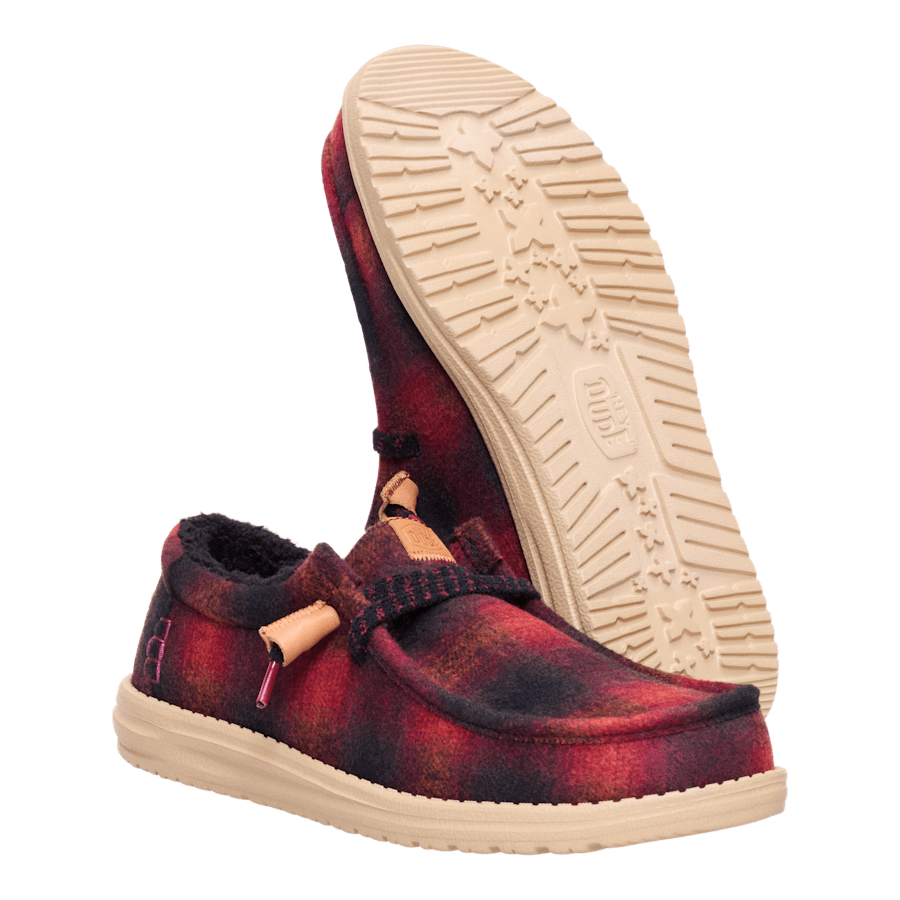 Hey Dude Wally Cozy Plaid slip-on shoes shown from side and sole angles