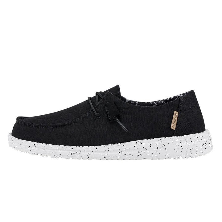 Hey Dude Wendy women's slip-on canvas shoe with white speckled sole, side view