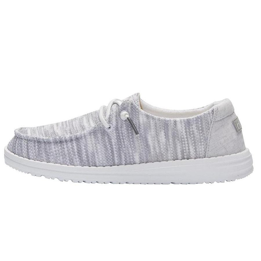 Hey Dude Wendy Sox slip-on shoe with striped knit upper and white sole, side view