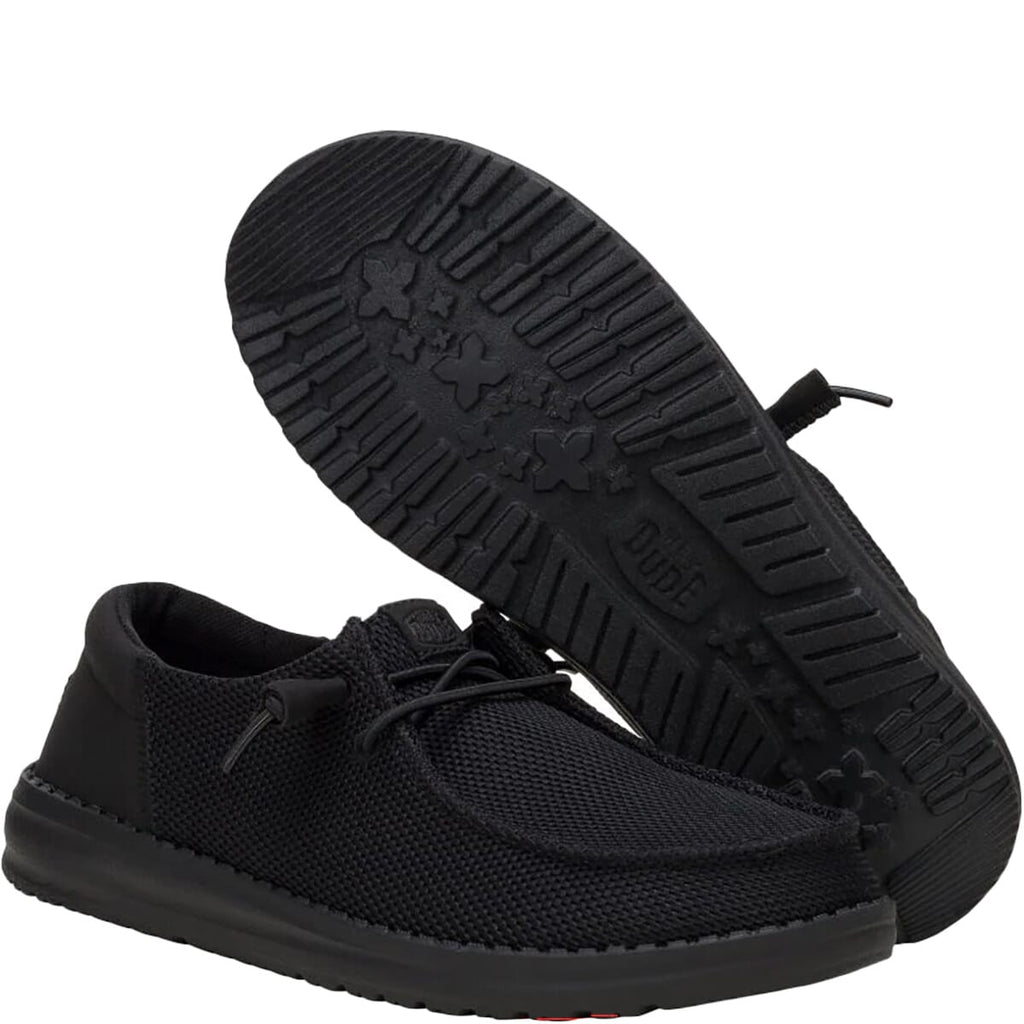 Hey Dude Wendy slip-on shoe shown alongside its textured rubber outsole tread pattern
