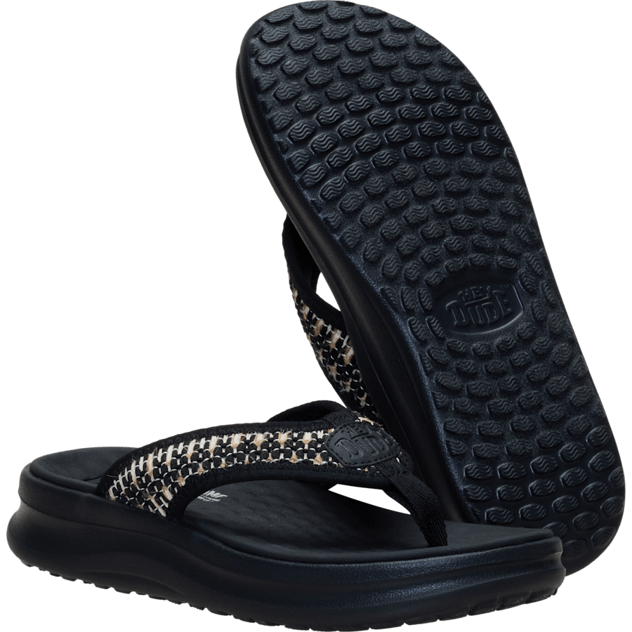 Hey Dude Womens Tide Flip flop sandal showing woven strap and textured outsole detail