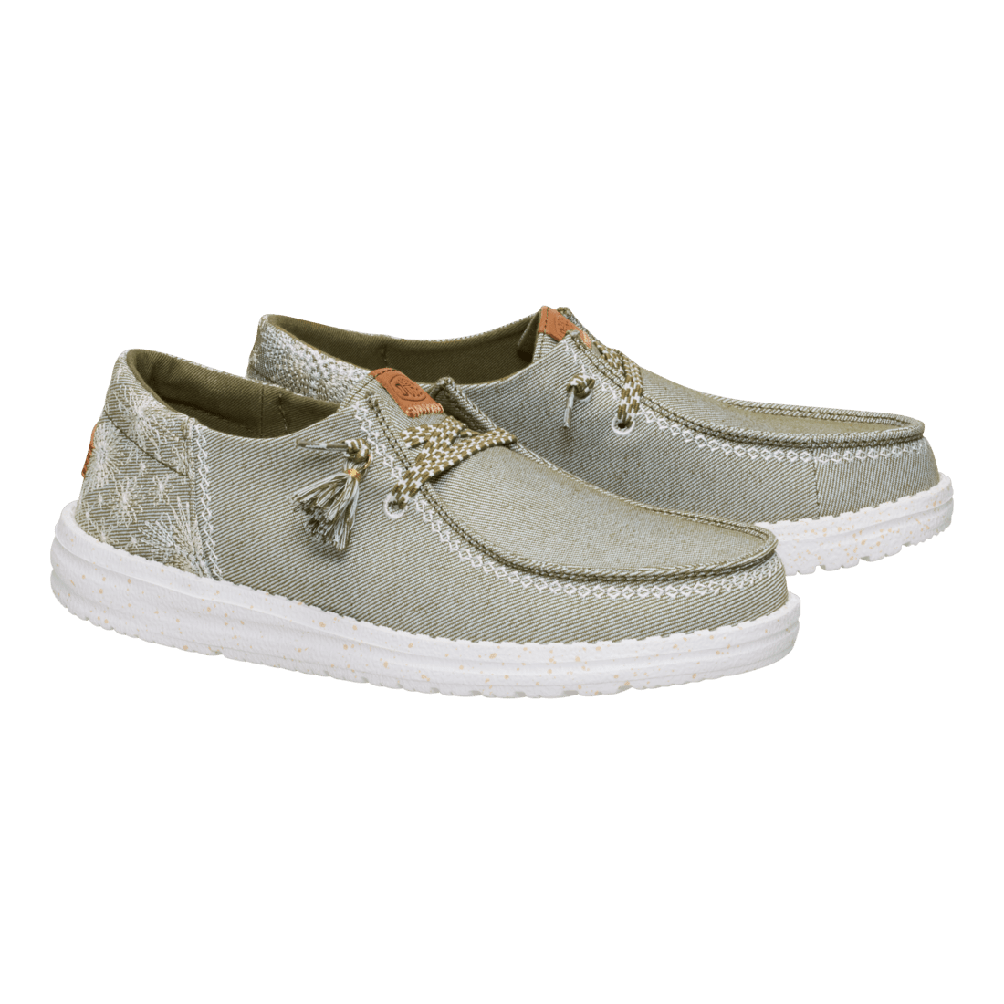 Hey Dude Wendy slip-on shoes with embroidered floral detail and tassel laces, pair angled view