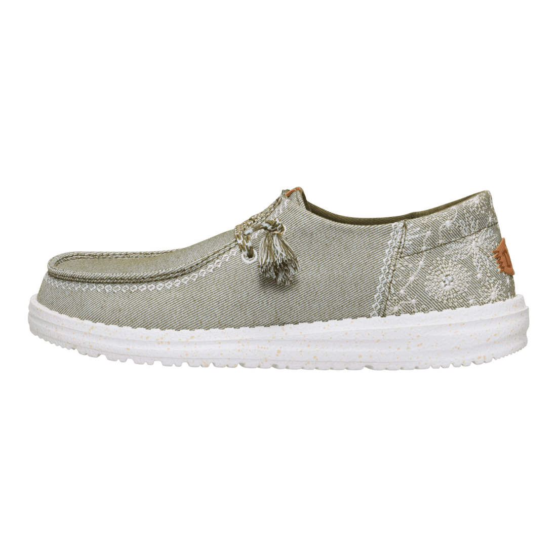 Hey Dude Wendy slip-on shoe with floral embroidery, tassel lacing, and white sole