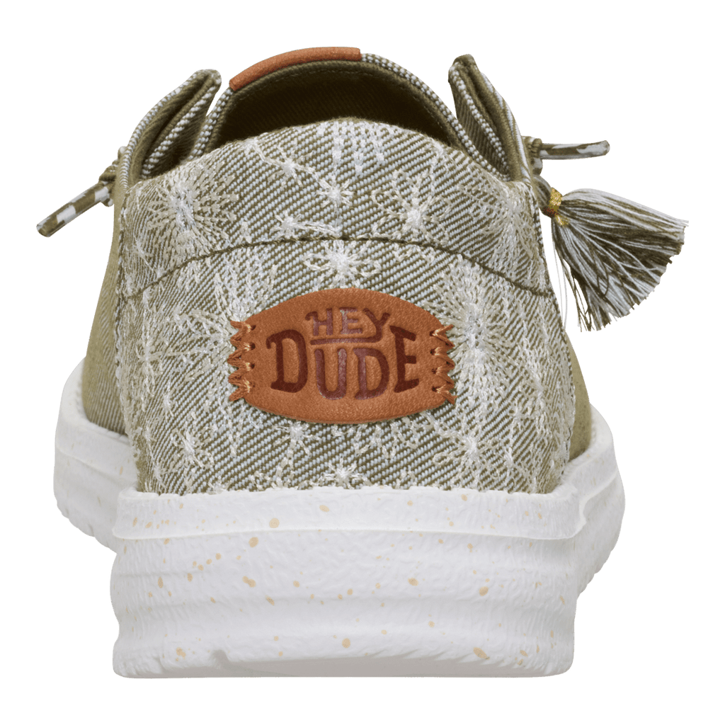 Hey Dude Wendy slip-on shoe back view showing heel logo patch and decorative tassel