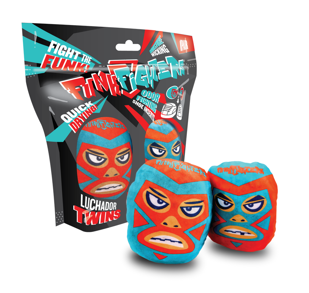 Pair of luchador mask-designed odor-fighting shoe inserts shown with retail packaging