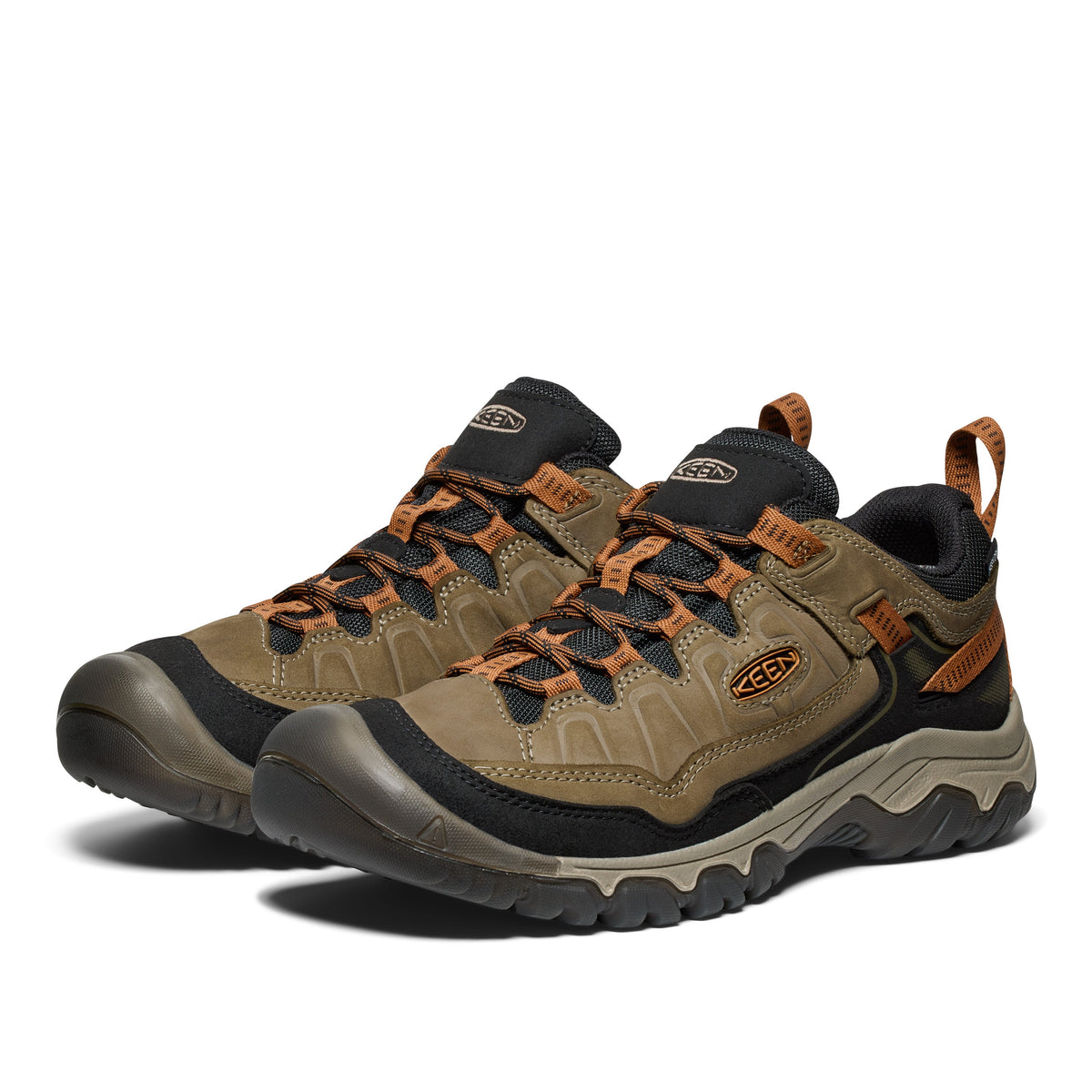 Keen men's low hiking shoes with rugged outsole, leather upper, and orange laces