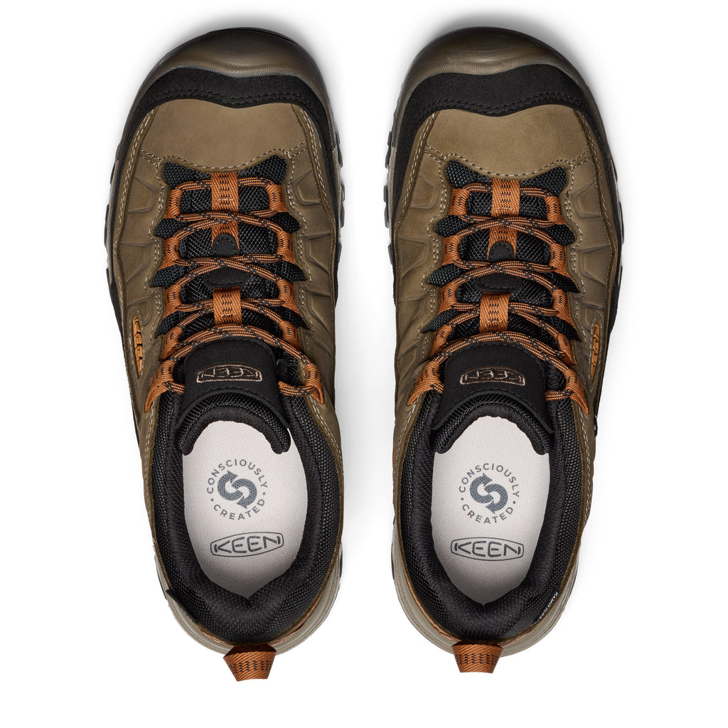 Top-down view of a pair of Keen waterproof low hiking shoes with orange laces