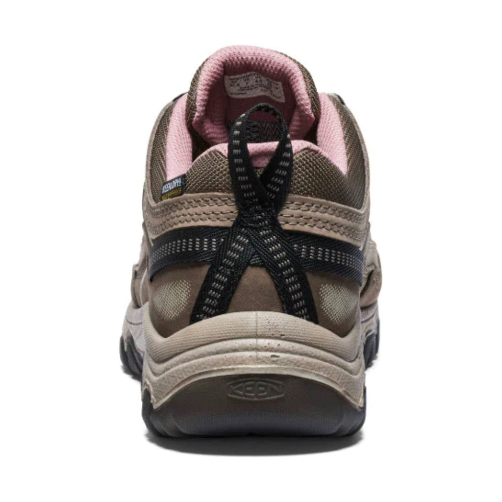 Rear view of a women's low waterproof hiking shoe with pink collar and black laces